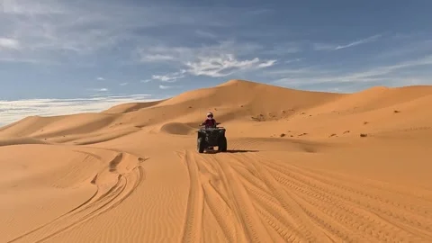 Quad in the dunes of the sahara Stock Footage 255723482