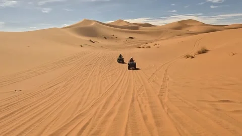 Quad in the dunes of the sahara Stock Footage 256307610