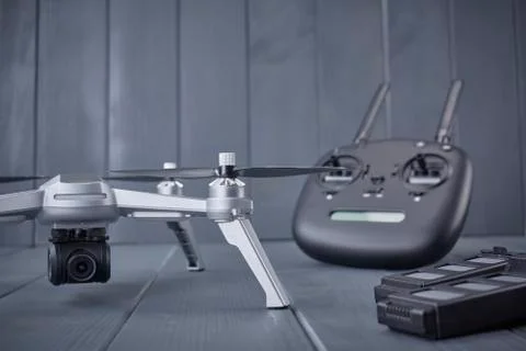 Quad-engine drone with high-resolution camera, batteries and radio control wi Stock Photos