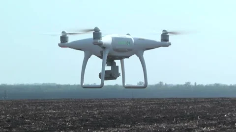 Quadcopter above ground Stock Footage 106930765