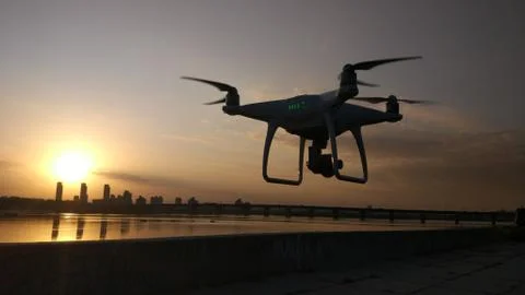Quadcopter against the sunset Foto stock