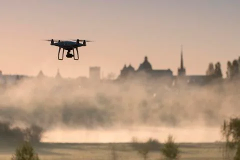 Quadcopter on the background of the architecture of the old city of Lutsk Stock Photos
