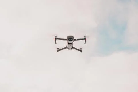 A quadcopter with a built-in camera flies into the sky, captures video footag 스톡 사진