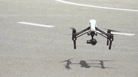 Quadcopter with camera during landing, slow motion Video stock 92410944