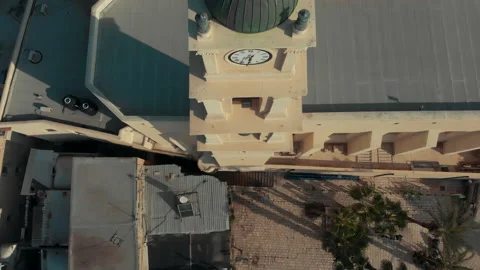 The quadcopter climbs up along the clock tower Stock Footage 147472462