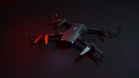 Quadcopter in a dark room illuminated by red light Vidéo 302959919