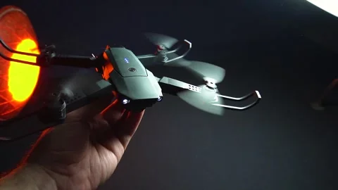 Quadcopter in a dark room illuminated by red light Stock Footage 302960010