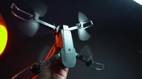 Quadcopter in a dark room illuminated by red light Видео 302960015