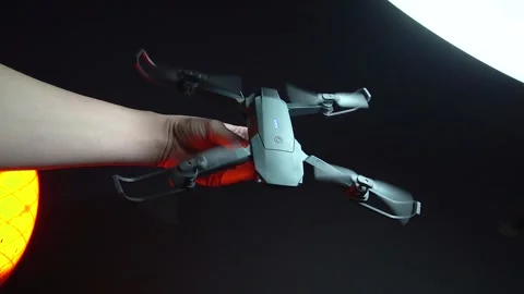 Quadcopter in a dark room illuminated by red light Stock-Footage 302960052