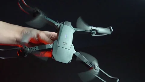 Quadcopter in a dark room illuminated by red light 库存影片 302960077
