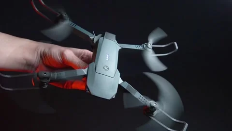 Quadcopter in a dark room illuminated by red light Vídeo Stock 302960112