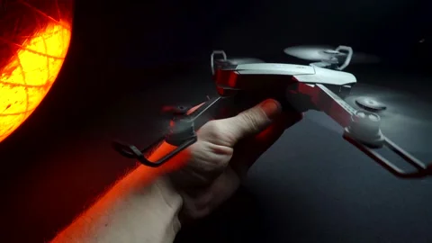 Quadcopter in a dark room illuminated by red light Vidéo 302960152