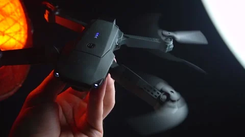 Quadcopter in a dark room illuminated by red light Vídeo Stock 302960153