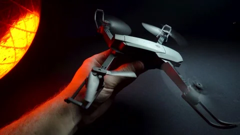 Quadcopter in a dark room illuminated by red light Vídeo Stock 302960188