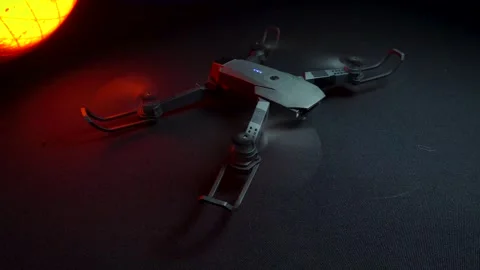 Quadcopter in a dark room illuminated by red light 動画素材 302960230
