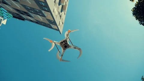 Quadcopter drone in the air Stock Footage 109229895