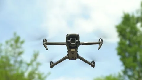 Quadcopter (drone) flying In Mid Air Stock Footage 242339175