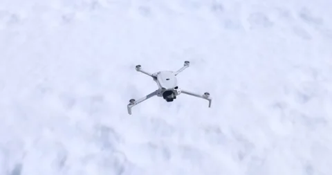 Quadcopter Drone Hovering Over Fresh Winter Snow Stock-Footage 343927558