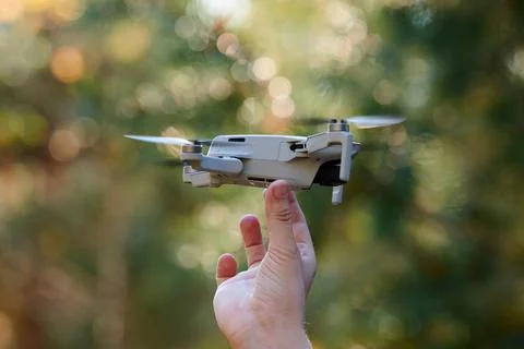 Quadcopter drone on operator hand Stock Photos