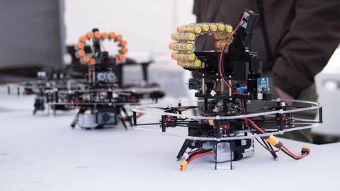 Quadcopter drone prototypes with clear protective frames and exposed electronics 库存照片