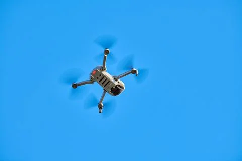Quadcopter drone in sky Stock Photos