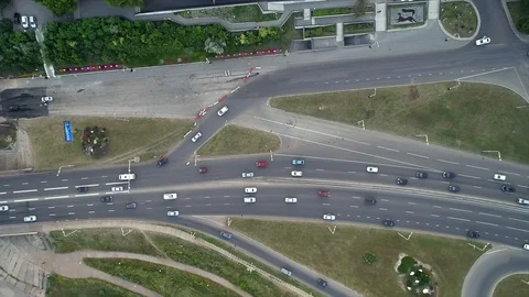 Quadcopter flies a fork in the road and flying over the bridge across the river. Stock Footage 127893530