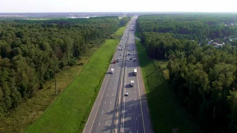 Quadcopter flies over the highway Stock Footage 161769236