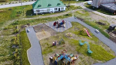 Quadcopter flies on the playground Stock Footage 160054661