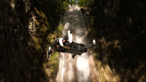 Quadcopter flying away in the forest Stock Footage 108069876