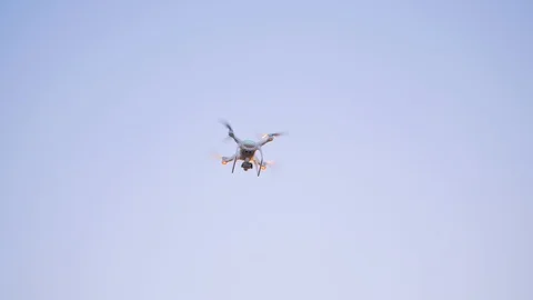 Quadcopter Flying in the Blue Sky. Stock Footage 89671035