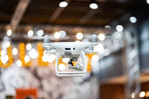Quadcopter flying inside a large warehouse Stock Photos