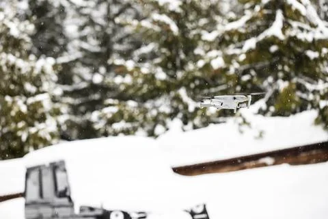 Quadcopter launch in winter snowy forest. Stock Photos