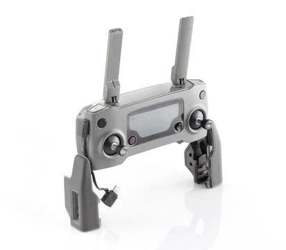 Quadcopter remote control on white background. Drone control panel. Stock Photos