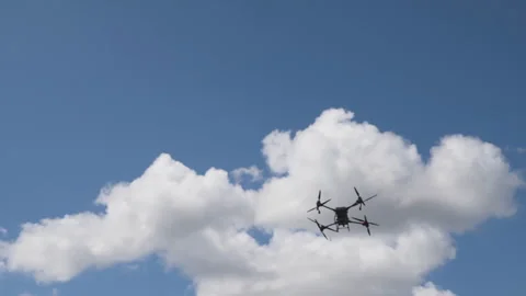 Quadcopter in the sky Видео 247477224