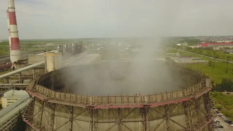 Quadcopter survey of a cooling tower and chimney of a thermal station Stock Footage 134335650