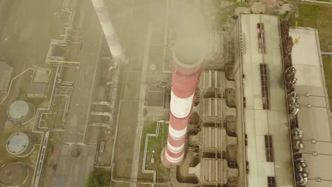 Quadcopter survey of a cooling tower and chimney of a thermal station Stock Footage 134336013
