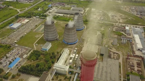 Quadcopter survey of a cooling tower and chimney of a thermal station Stock Footage 134336017