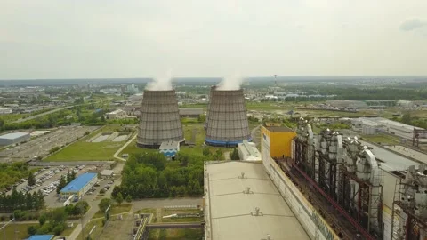 Quadcopter survey of a cooling tower and chimney of a thermal station Stock Footage 134336038