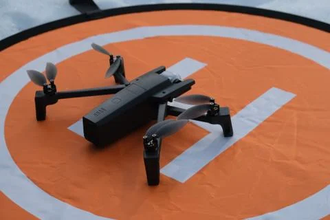 Quadcopter is on the take-off lap. Stock Photos