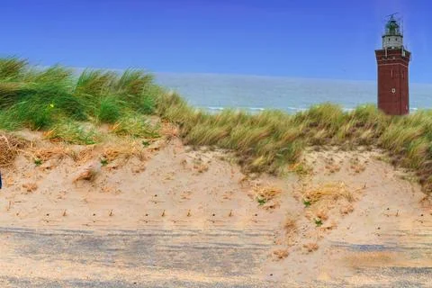 Quadrangular Lighthouse in the dunes Quadrangular Lighthouse in the sand d... Stockfoto's