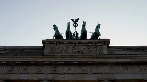 Quadriga statue on top of Brandenburg Gate in Berlin, hand held slow motion. Video stock 116258344