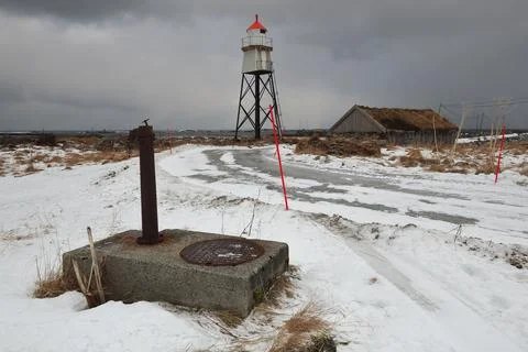 Quadripod lighthouse-dry masonry-thatch roof hut. Nordmela-Andoya-Vesteralen-NO Stock Photos