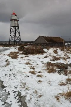 Quadripod lighthouse-dry masonry-thatch roof hut. Nordmela-Andoya-Vesteralen-NO Stock Photos