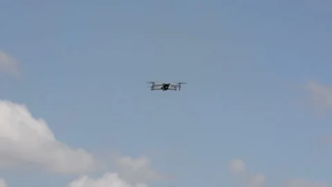 Quadrocopter on a background of blue sky. Modern technologies of video surveilla 库存影片 155865181
