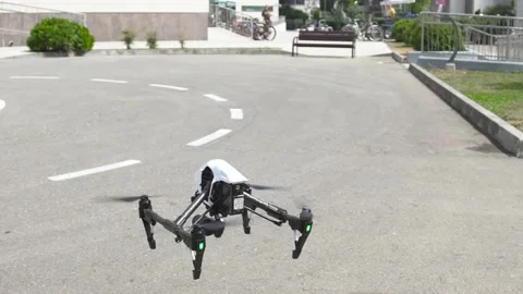 Quadrocopter with camera takes off into the sky, slow motion Stock Footage 92410848