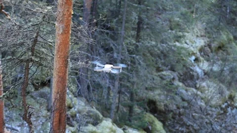 Quadrocopter dives steeply to a waterfall Stock Footage 247632797