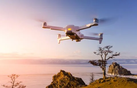 Quadrocopter in flight in nature Stock Photos