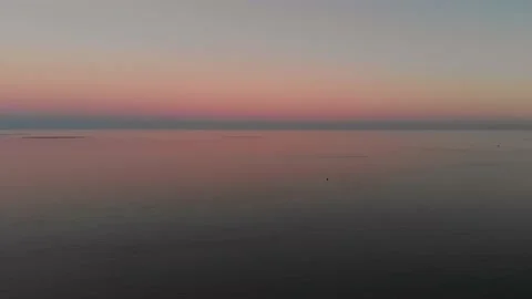Quadrocopter flight at sunset. Pink sunset and sea. 스톡 동영상 132330722