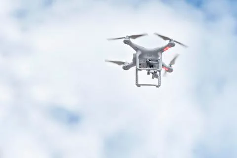 Quadrocopter flying in the sky Stock Photos