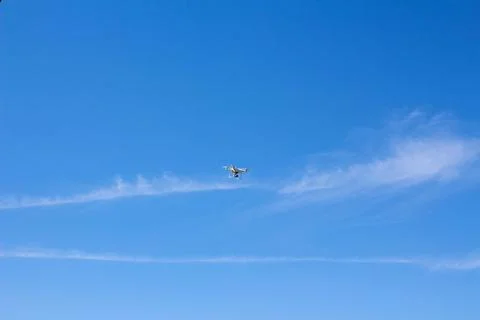 Quadrocopter flying in the sky Stock Photos